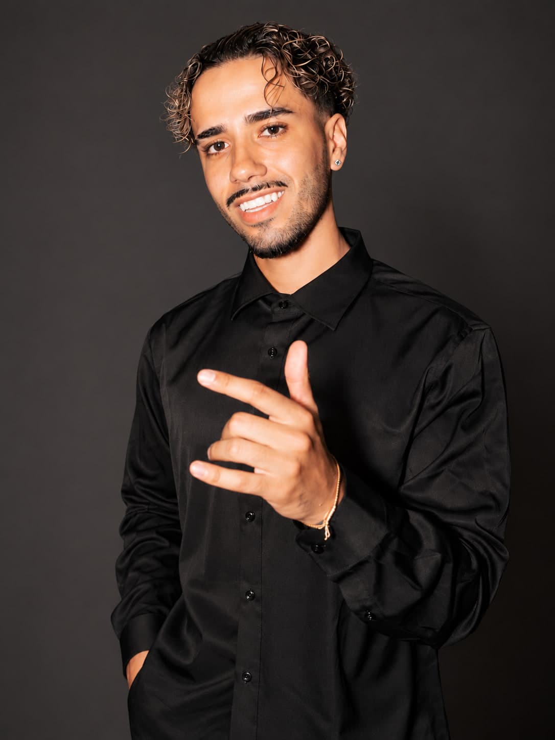 Smiling Young Man in Black Shirt