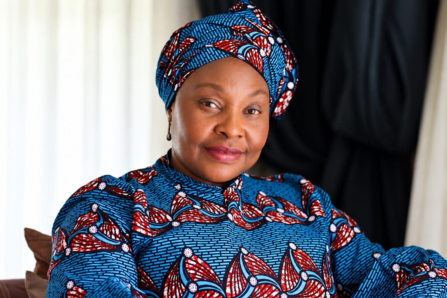 Confident Portrait in Blue and Red Traditional Attire